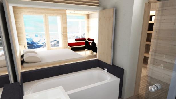 Blick aus einem Badezimmer auf ein Schlafzimmer mit Bergblick.