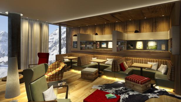 Ein gemütlicher Aufenthaltsraum mit Holzwänden und Blick auf schneebedeckte Berge.