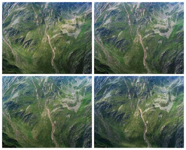 Luftaufnahme einer grünen Berglandschaft mit einem kleinen Bach.