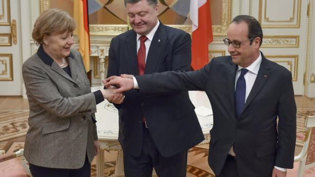 Angela Merkel, Petro Poroschenko und François Hollande bei einem Treffen.