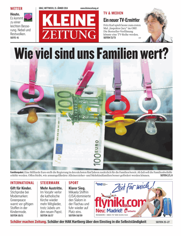 Schnuller und eine 100-Euro-Note hängen an einer Wäscheleine.