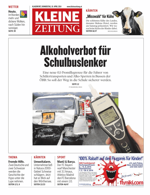 Ein Alkoholtester zeigt 0,00 mg/L neben einem beschädigten Schulbus.