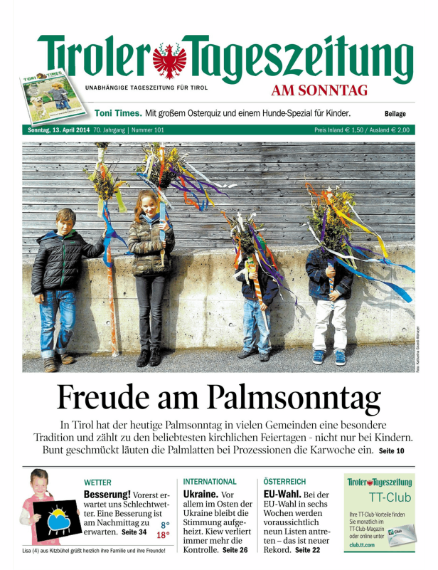 Kinder mit geschmückten Palmbuschen am Palmsonntag in Tirol.