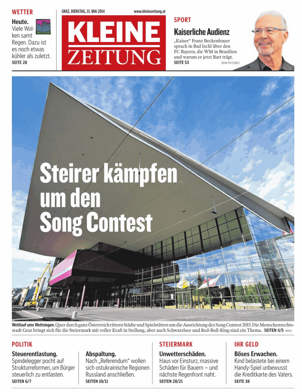Die Grazer Stadthalle, auf der ein Banner mit der Aufschrift „Steirer kämpfen um den Song Contest“ hängt.