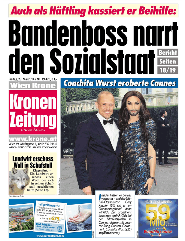 Conchita Wurst und ein Mann posieren auf einer Veranstaltung in Cannes.