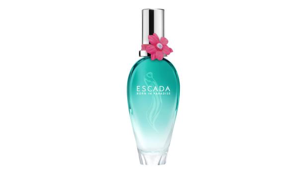 Eine Flasche „Escada Born in Paradise“ Eau de Toilette mit einer rosa Blume am Verschluss.