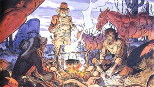 Eine Gruppe von Cowboys sitzt am Lagerfeuer in einer Wüstenlandschaft.