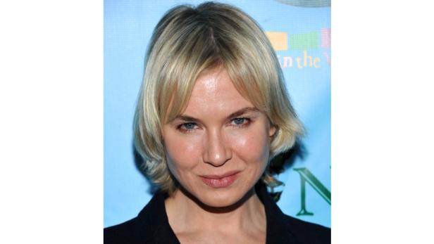 Ein Porträt von Renée Zellweger mit blonden Haaren.
