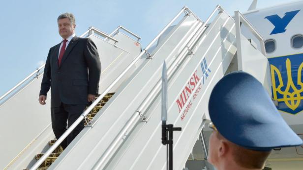 Poroschenko und Putin: Handschlag in Minsk