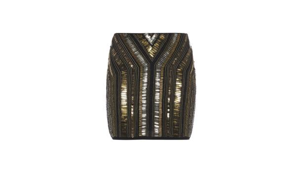 Ein Minirock mit goldenen und silbernen Pailletten auf schwarzem Stoff.