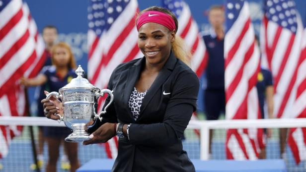 Williams of the U.S. poses with her trophy after d