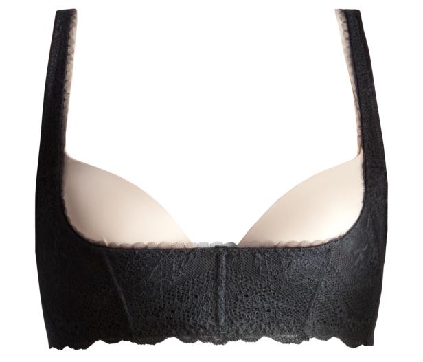 Ein schwarzes Bustier mit Spitze und hellen Cups.