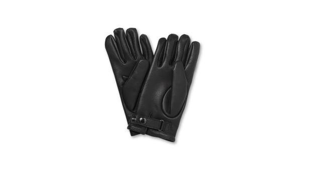 Ein Paar schwarze Lederhandschuhe liegen auf einem weißen Hintergrund.