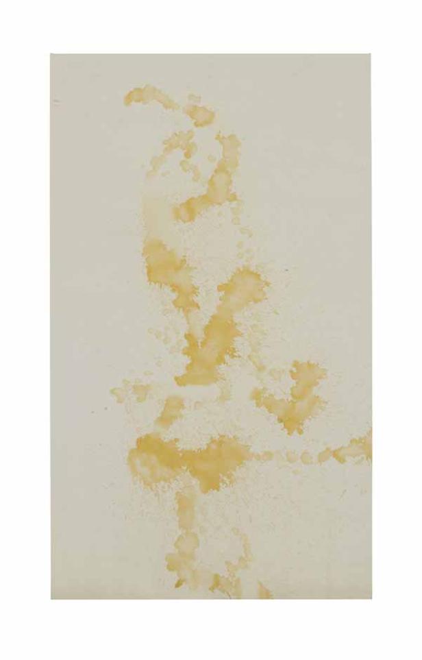 Gelbe Farbspritzer bilden ein abstraktes Muster auf einem hellen Hintergrund.