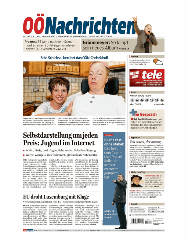 Eine Frau und ein Mann sitzen nebeneinander; Artikel über das OÖN-Christkindl.