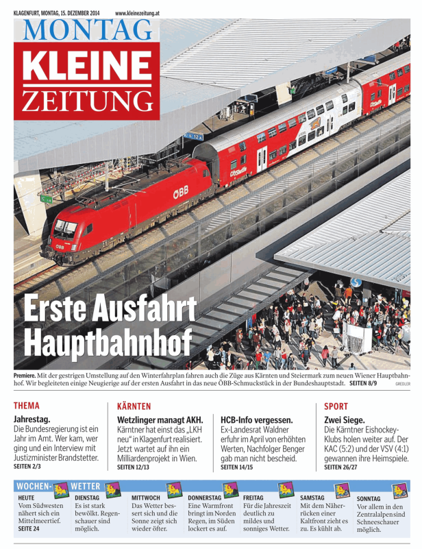 Ein roter ÖBB-Zug fährt in den Wiener Hauptbahnhof ein.