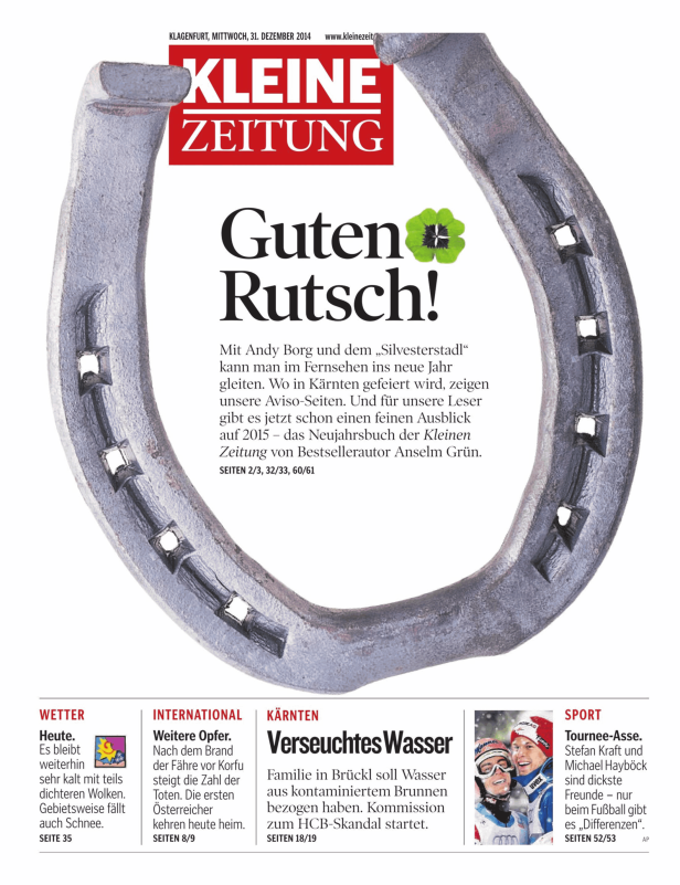 Ein Hufeisen und ein vierblättriges Kleeblatt wünschen „Guten Rutsch!“.