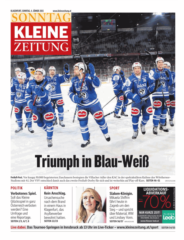 Eine Eishockeymannschaft der Villacher Adler feiert einen Sieg.