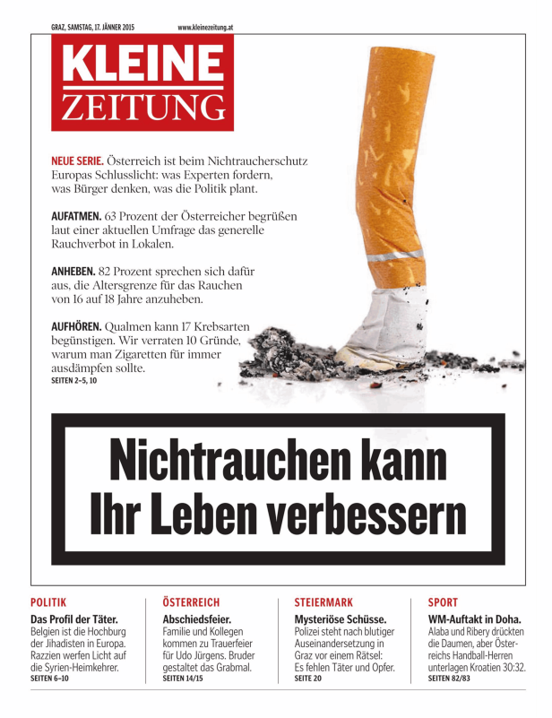 Eine Zigarettenkippe und Asche vor dem Hintergrund einer Zeitung, die für Nichtrauchen wirbt.