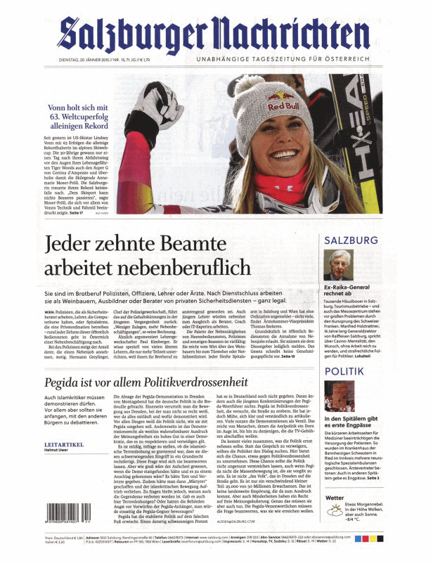 Lindsey Vonn mit Mütze und Skiausrüstung lächelt auf einem Zeitungsfoto der „Salzburger Nachrichten“.