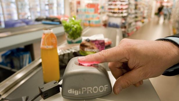 Customer uses Tip2Pay, a fingerprint payment machi