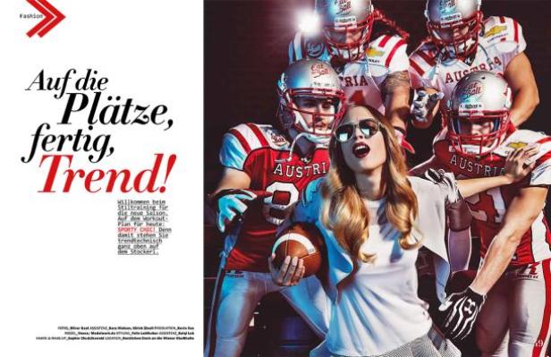 Eine Frau mit Sonnenbrille posiert mit American-Football-Spielern in rot-weißen Trikots.