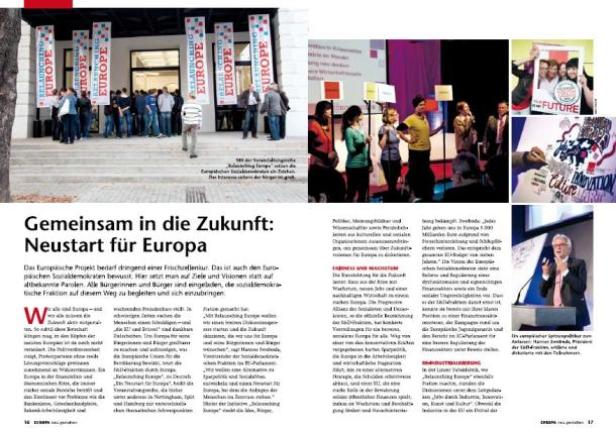 Menschen nehmen an einer Veranstaltung teil, die mit Bannern mit der Aufschrift „Relaunching Europe“ wirbt.