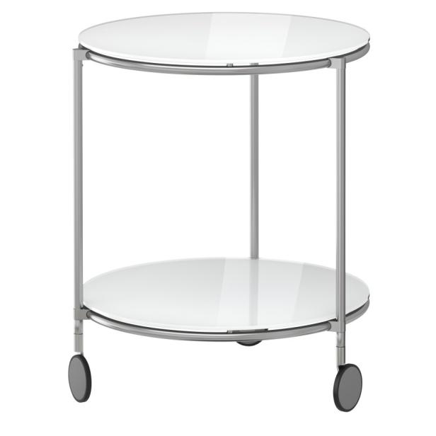 Ein runder Beistelltisch mit zwei Glasplatten und Rollen.