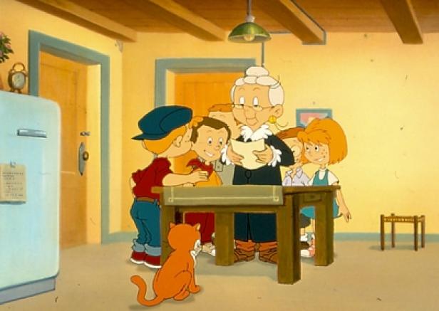 Die Abenteuer der Prudence Petitpas, eine erstes RiC-Highlight in den kommenden September-Tagen (c: ric tv) Eine Großmutter liest einer Gruppe von Kindern in einer Küche etwas vor.