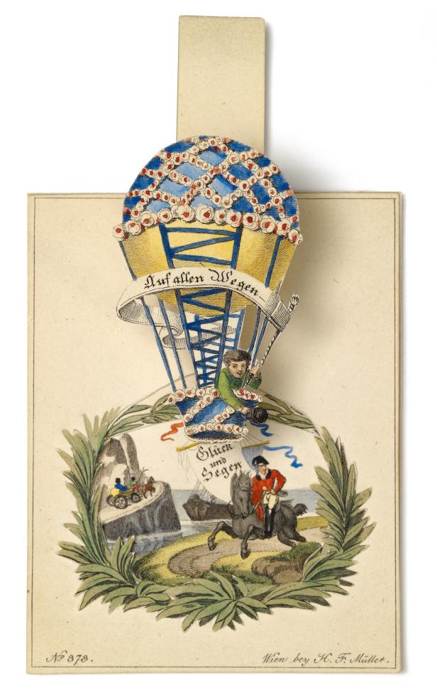 Eine historische Glückwunschkarte mit einem Heißluftballon und einem Reiter.