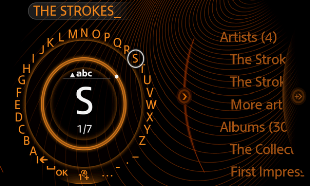 Ein Menübildschirm mit dem Bandnamen „The Strokes“ und einer alphabetischen Suchfunktion.