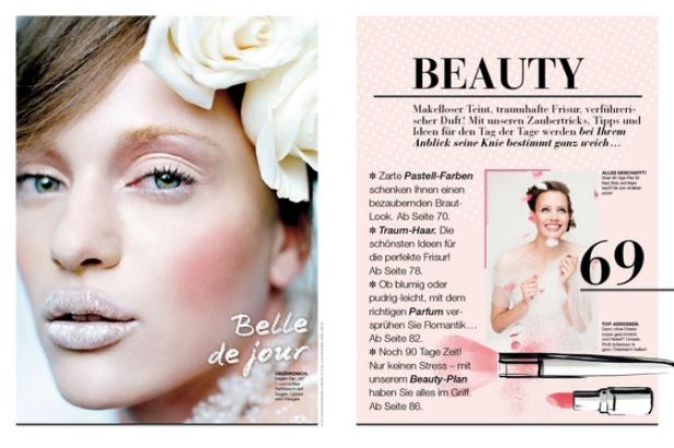 Eine Frau mit weißen Rosen im Haar und hellem Make-up präsentiert einen Braut-Look.