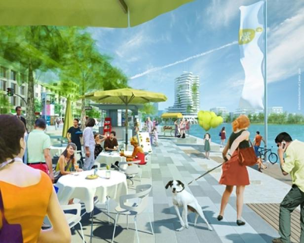 Eine Uferpromenade mit Cafés, Menschen und einem Hund an der Leine.