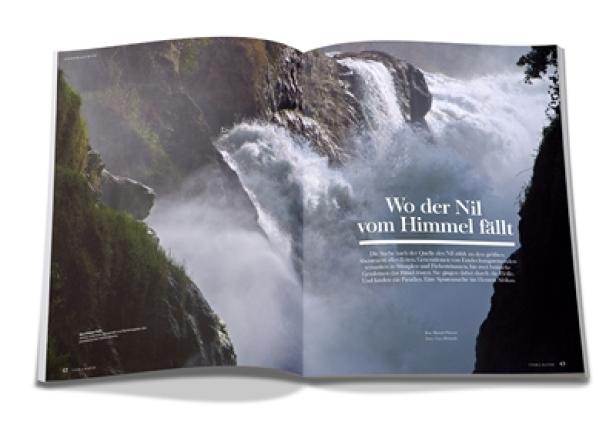 Terra Mater - Magazin - Erstausgabe 1 - Juni 2012 - Red Bulletin Verlag Ein aufgeschlagenes Magazin zeigt einen Wasserfall zwischen grünen Felsen.