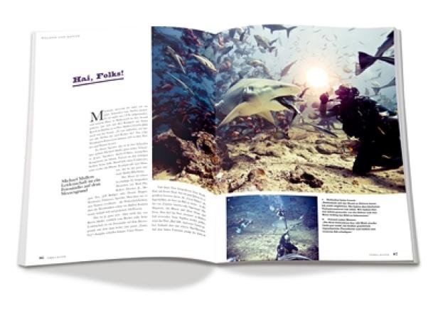 Terra Mater - Magazin - Erstausgabe 1 - Juni 2012 - Red Bulletin Verlag Ein aufgeschlagenes Magazin zeigt ein Foto von einem Hai und einem Taucher unter Wasser.