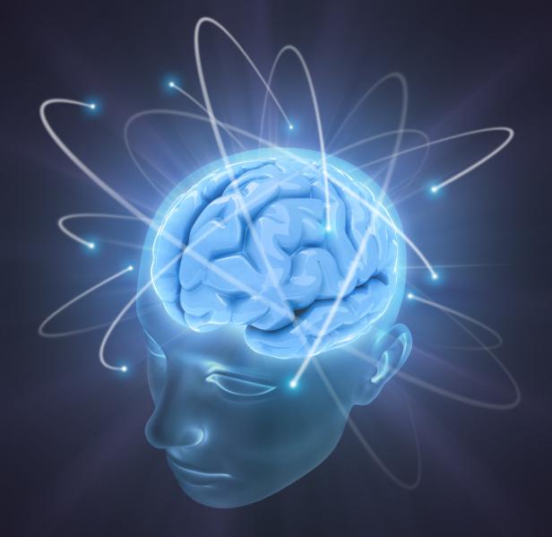 Ein blaues Gehirn in einem transparenten Kopf mit leuchtenden Verbindungen.