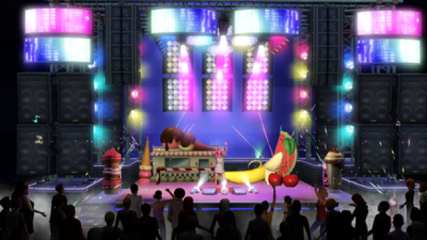 Die Sims 3 Showtime Katy Perry Collectors Edition (c: electronic arts) Eine Sängerin steht auf einer Bühne mit überdimensionalen Eisbechern und Früchten vor einem Publikum.