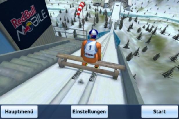 Skijumpgiants.at - iPhone-App - Greentube - Red Bull Media House Ein Skispringer sitzt auf dem Startbalken und bereitet sich auf den Sprung vor.