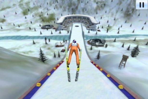 Skijumpgiants.at - iPhone-App - Greentube - Red Bull Media House Ein Skispringer auf einer schneebedeckten Schanze.
