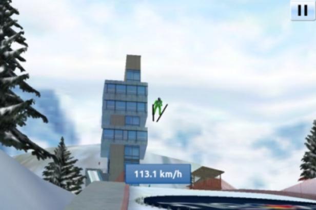 Skijumpgiants.at - iPhone-App - Greentube - Red Bull Media House Ein Skispringer springt von einer Schanze; im Vordergrund wird eine Geschwindigkeit von 113,1 km/h angezeigt.