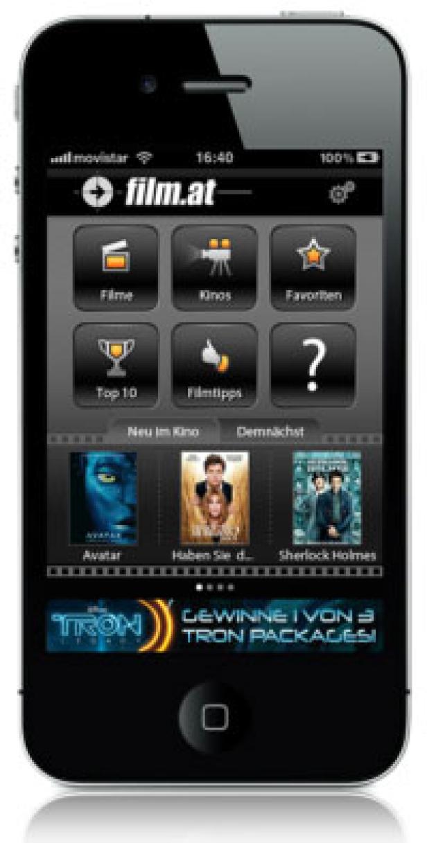 Film.at - iPhone-App - Entertainment Media - App-Nenu Ein iPhone zeigt die „film.at“-App mit Filmvorschlägen wie „Avatar“ und „Sherlock Holmes“.