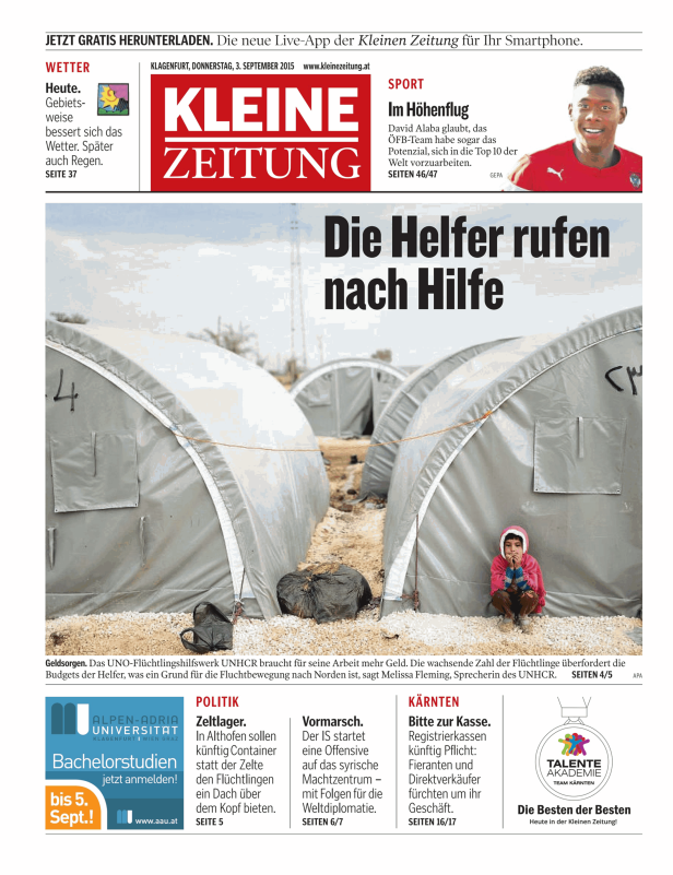 Ein kleines Mädchen sitzt vor einem Zelt in einem Flüchtlingslager.