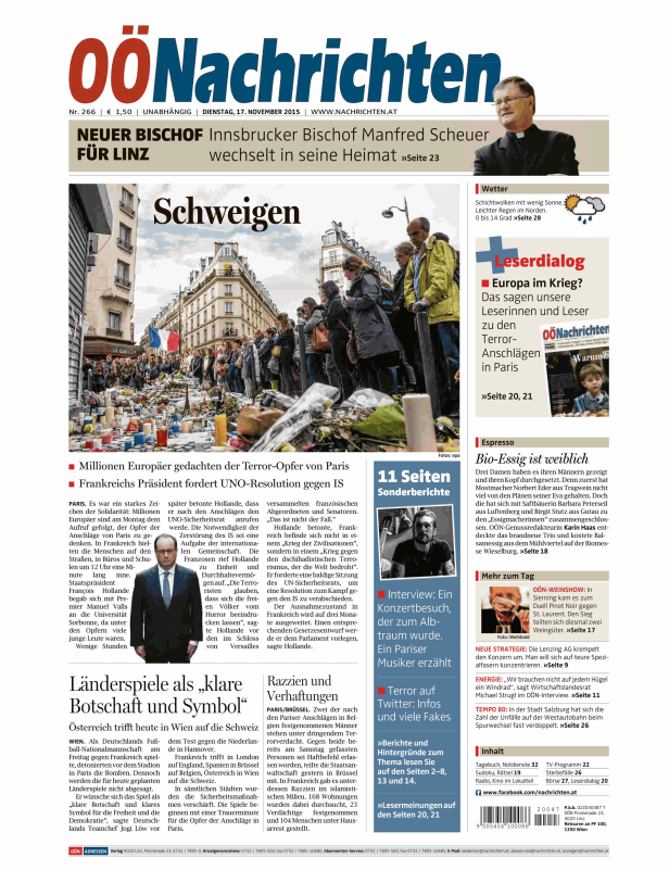 Eine Menschenmenge gedenkt der Opfer der Terroranschläge in Paris vor dem Restaurant Le Carillon.