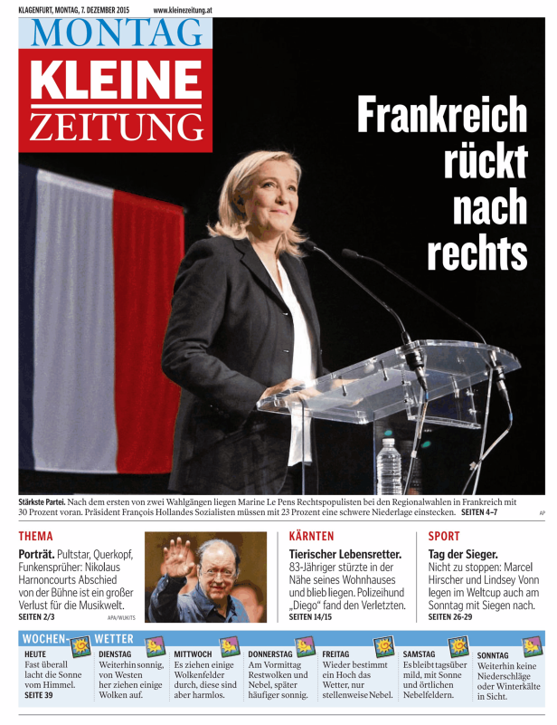Marine Le Pen spricht vor einer französischen Flagge auf einer Wahlveranstaltung.