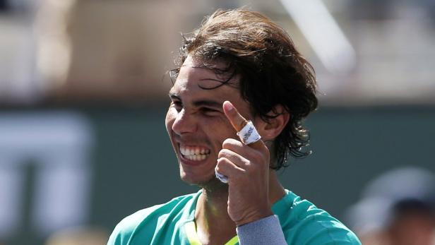 Nadal of Spain celebrates defeating Berdych of the