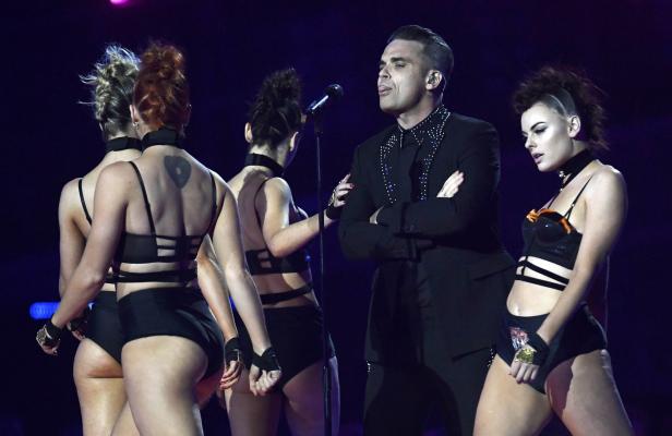 Robbie Williams performs at the Brit Awards at the