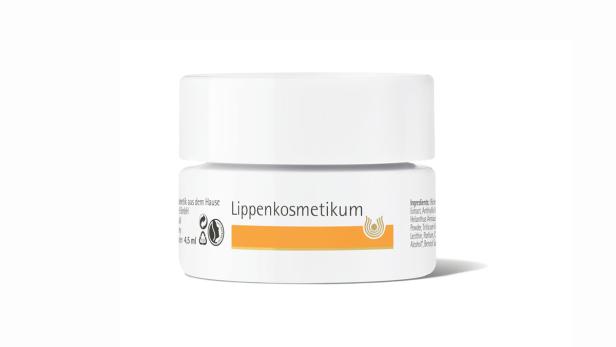 Ein Tiegel Lippenkosmetik steht vor einem weißen Hintergrund.