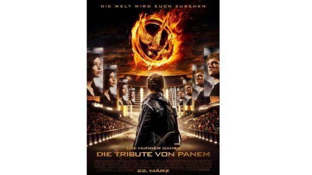 Das Filmplakat für „Die Tribute von Panem“ zeigt Katniss mit Pfeil und Bogen vor dem Hintergrund der Arena.