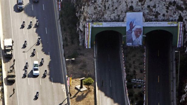 REUTERSThe convoy of Pope Benedict XVI proceeds towards where a mass is being held in Beirut, September 16, 2012. Pope Benedict urged Middle Eastern Christians on Sunday to work for peace and against "the grim trail of death and destruction" in thrld, id,