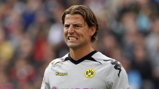 Ein Fußballspieler von Borussia Dortmund mit angestrengtem Gesichtsausdruck.